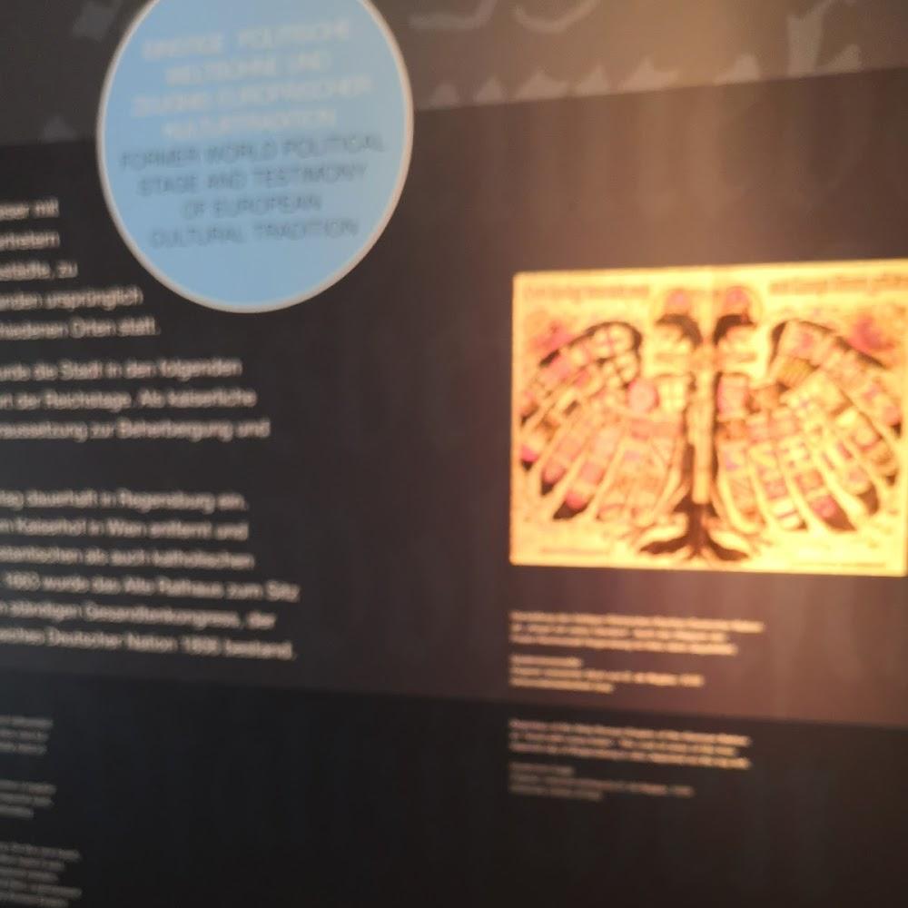 A framed artwork of a gold eagle.